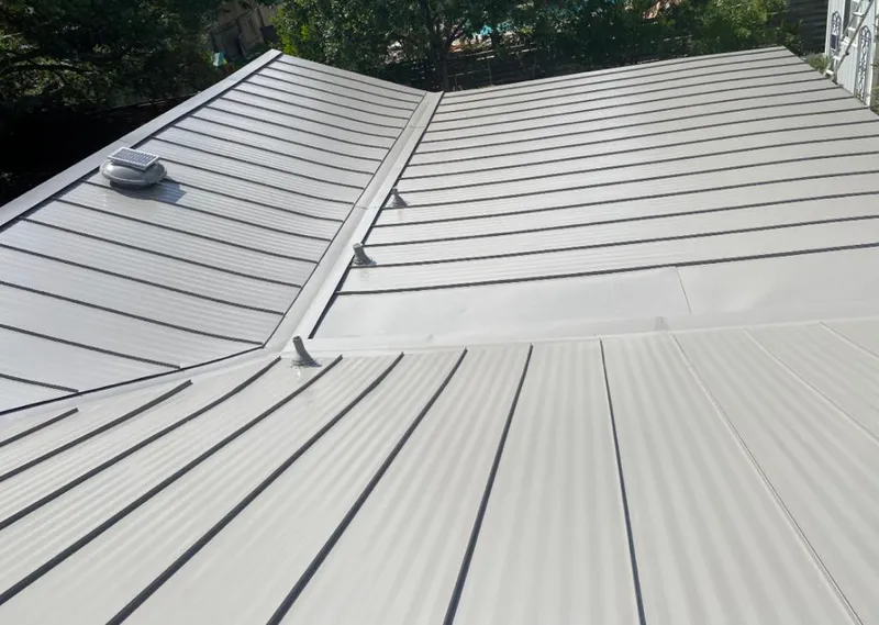 Solar attic fan installed on a metal roof for Roof Ventilation in New Carrollton